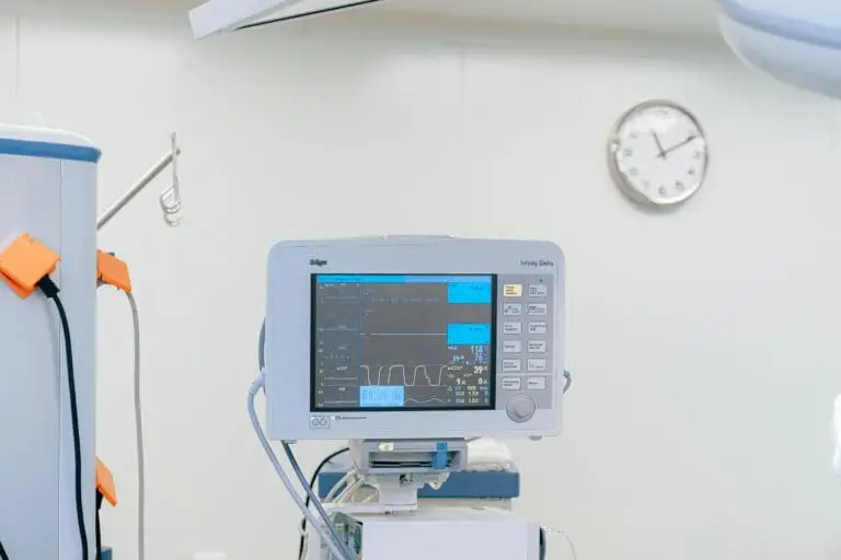 A modern heart rate monitor in a sterile hospital setting, showcasing medical technology.